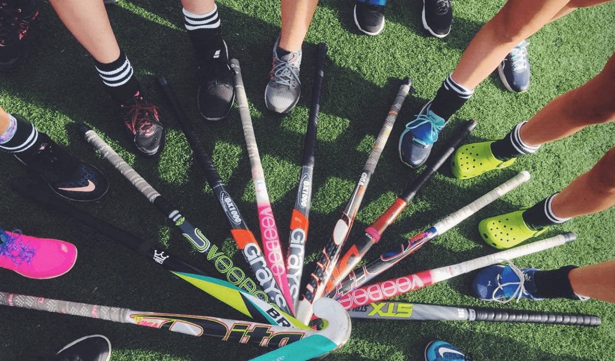 Middle school students practicing field hockey at Paul Goode Field in San Francisco